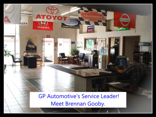 Our lobby with manufacturer flags overhead, Brennen at the service desk on the phone